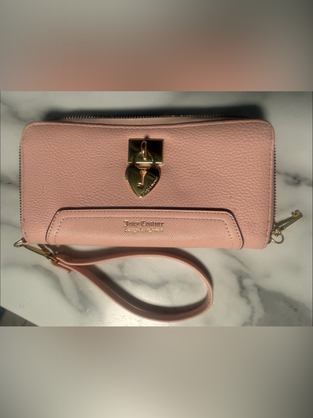 Juicy Couture Pebbled Leather Wristlet in Blush Pink with Gold-Tone Hardware